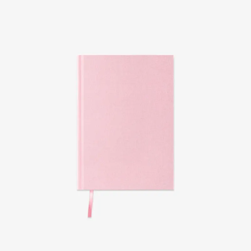 Pink notebook on a light gray background