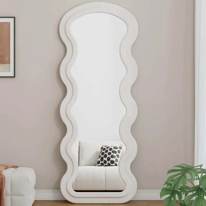 White wavy flannel mirror reflecting sofa and cushion